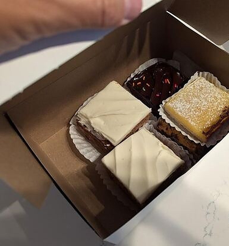 Box of frosted squares from Peach Tree Bakery